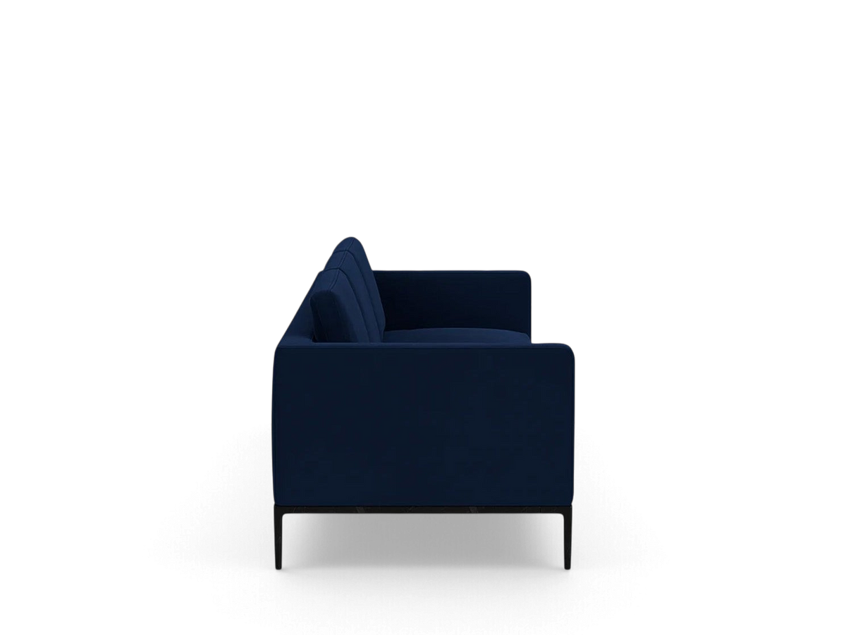 Side view of the navy blue upholstered Oma 101 inch sofa by urbane EQ3 with a black anthracite metal base.