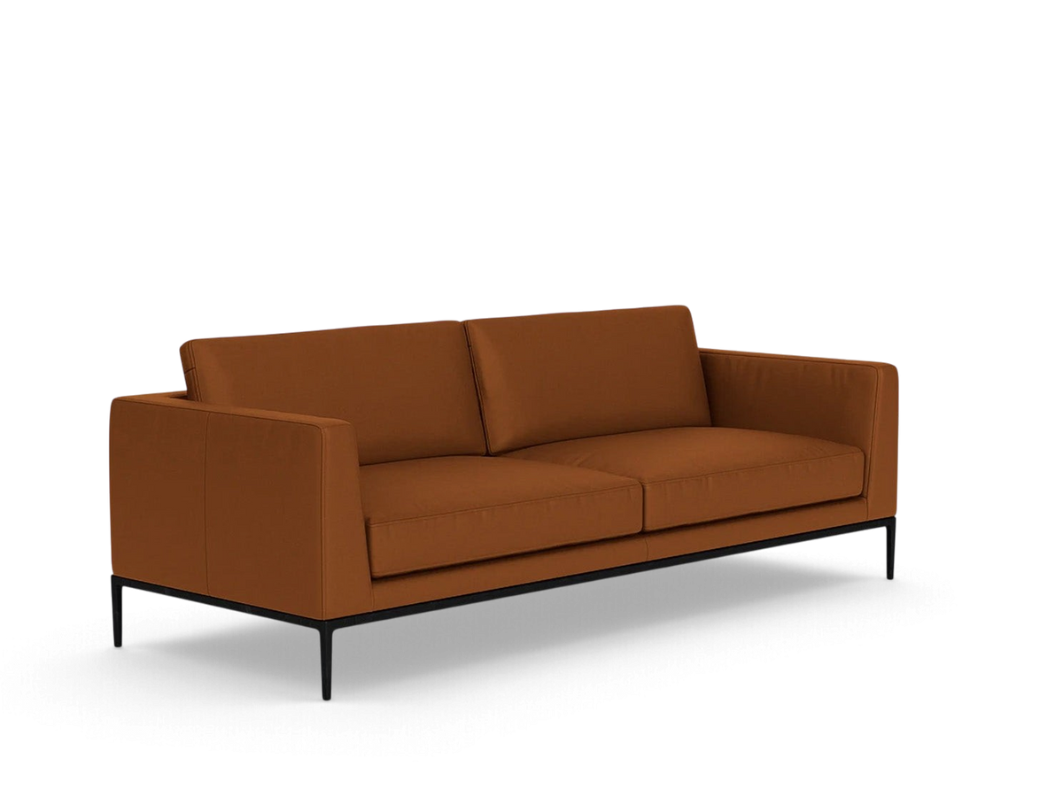 urbane EQ3 Oma 89-inch sofa in rust-coloured upholstery with a sleek black anthracite metal base