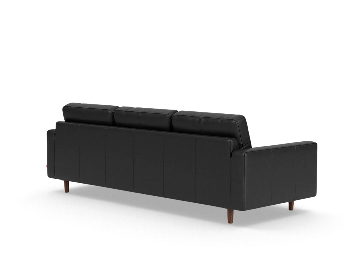 urbane EQ3 Oskar 93-inch black leather sofa viewed from the back showing wooden legs and classic cushion design