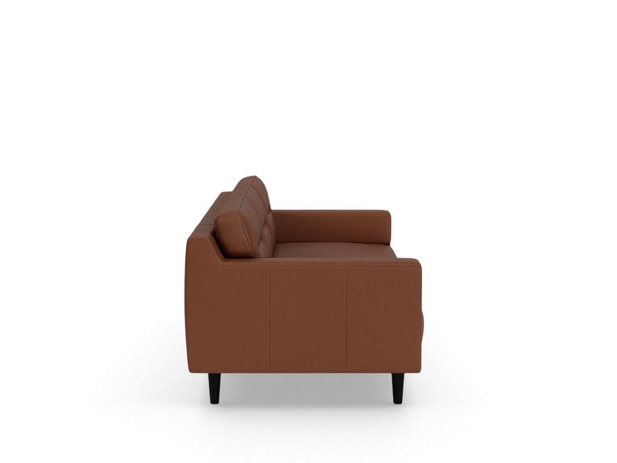 Side profile of an urbane EQ3 Remi 101-inch sofa in brown leather with contemporary horizontal pull cushion detail.