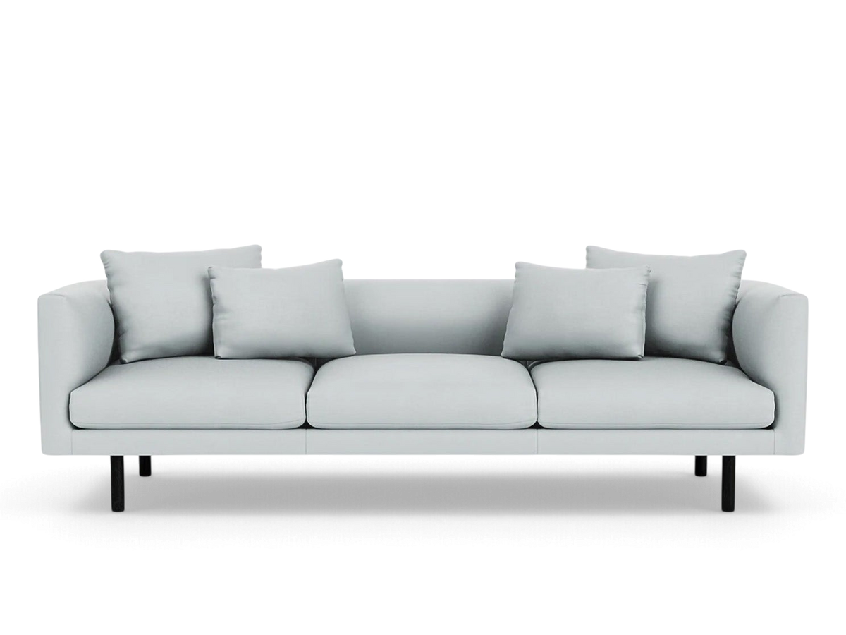 urbane EQ3 Replay 99 inch sofa in light grey fabric with black legs and four matching throw pillows