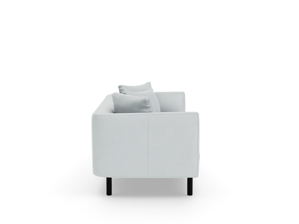Side view of the urbane EQ3 Replay 99 inch sofa in light grey fabric with a sleek, modern design and black legs.