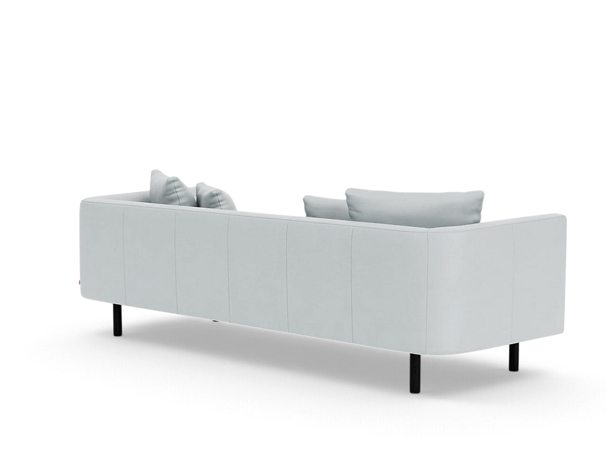 urbane EQ3 Replay 99 inch sofa in light grey fabric with a flexible back frame and black legs, rear view