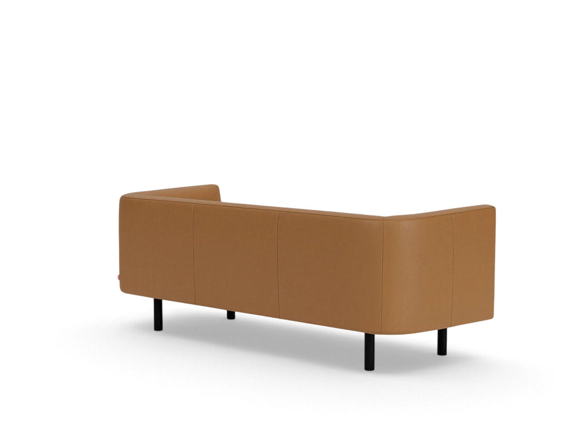 urbane EQ3 Replay Club sofa in tan leather with a sleek back view and minimalist black legs