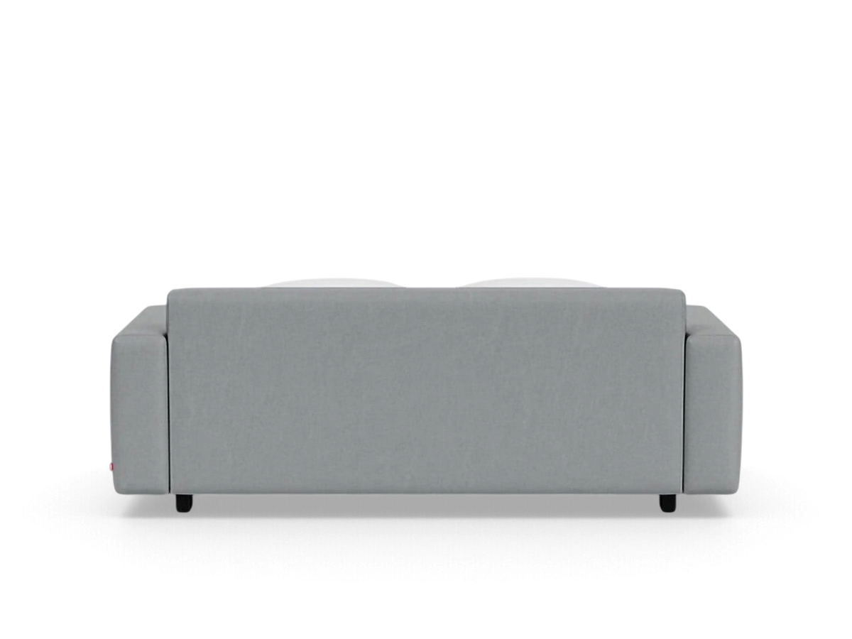 Back view of the grey upholstered urbane EQ3 Reva double sleeper sofa with a sleek, modern design.