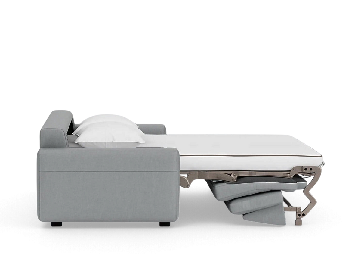 urbane EQ3 Reva double sleeper sofa in grey with a pull-out memory foam mattress and white pillows, side view