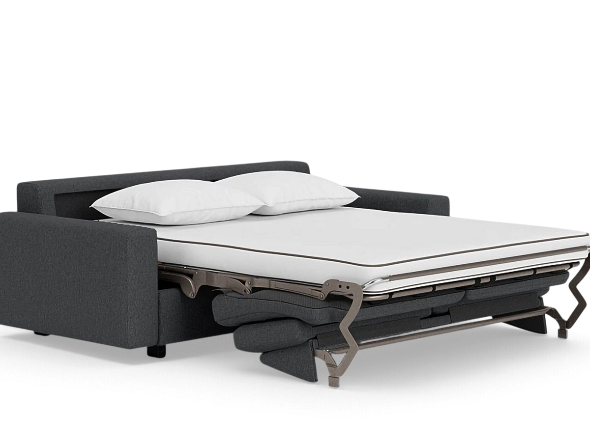 urbane EQ3 Reva queen sleeper sofa in dark grey fabric with a pulled-out memory foam mattress and two white pillows.