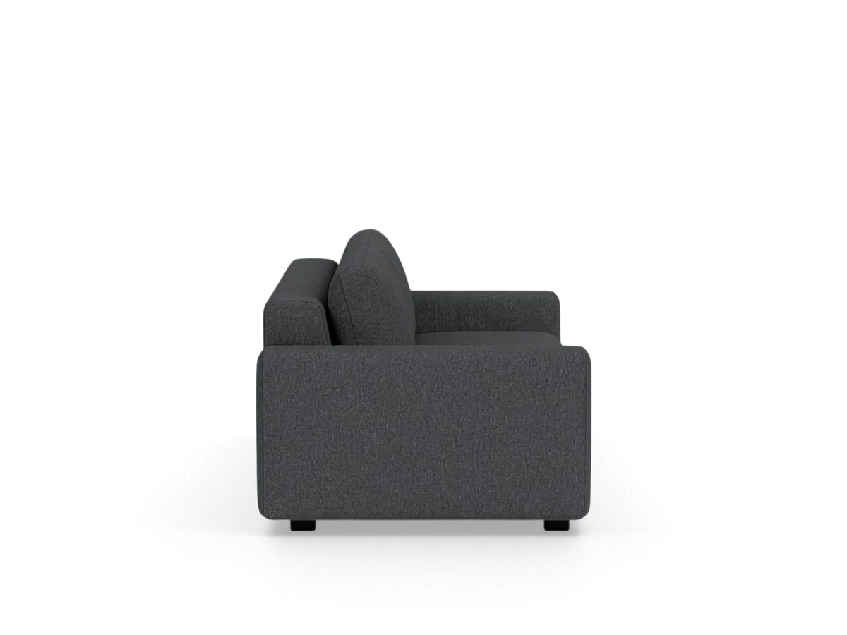 urbane EQ3 Reva double sleeper sofa in dark grey fabric with a sleek, modern profile and low arms, side view