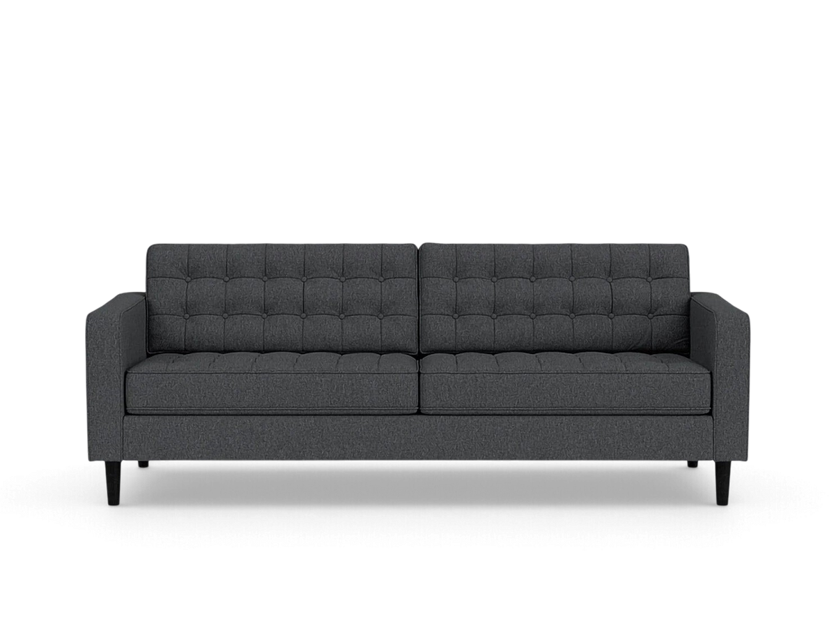 urbane EQ3 Reverie 86-inch charcoal grey sofa with button-tufted cushions and tapered wooden legs in mid-century style