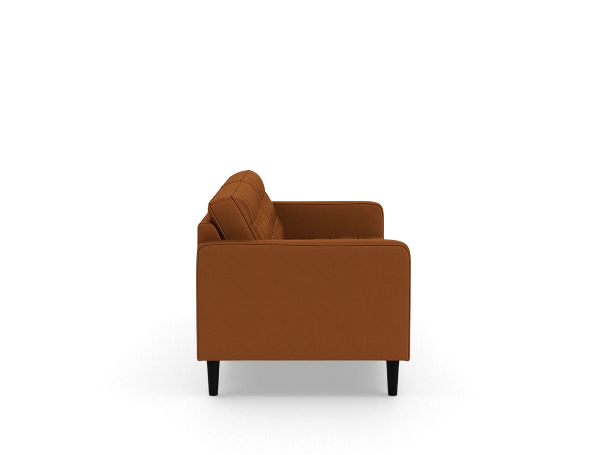 urbane EQ3 Reverie 86 inch sofa in rust fabric with button-tufted back and tapered black legs, side view