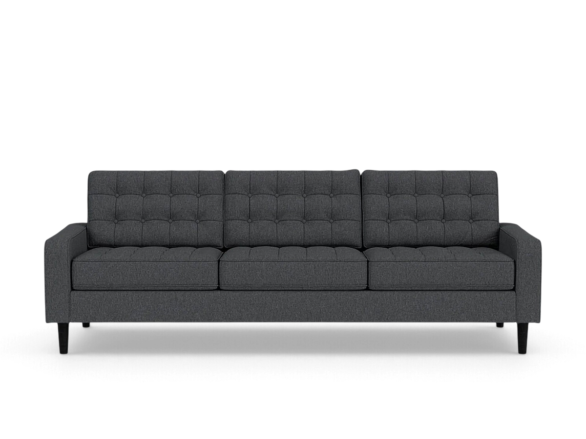 urbane EQ3 Reverie 92-inch charcoal grey button-tufted sofa with tapered wooden legs on a white background