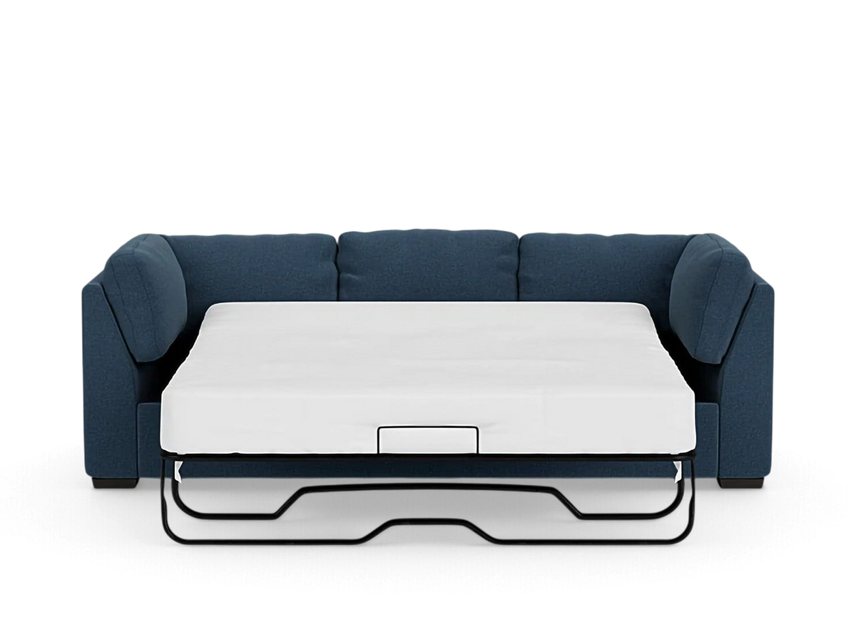 urbane EQ3 Salema sleeper sofa in blue upholstery with a white mattress extended for guest use