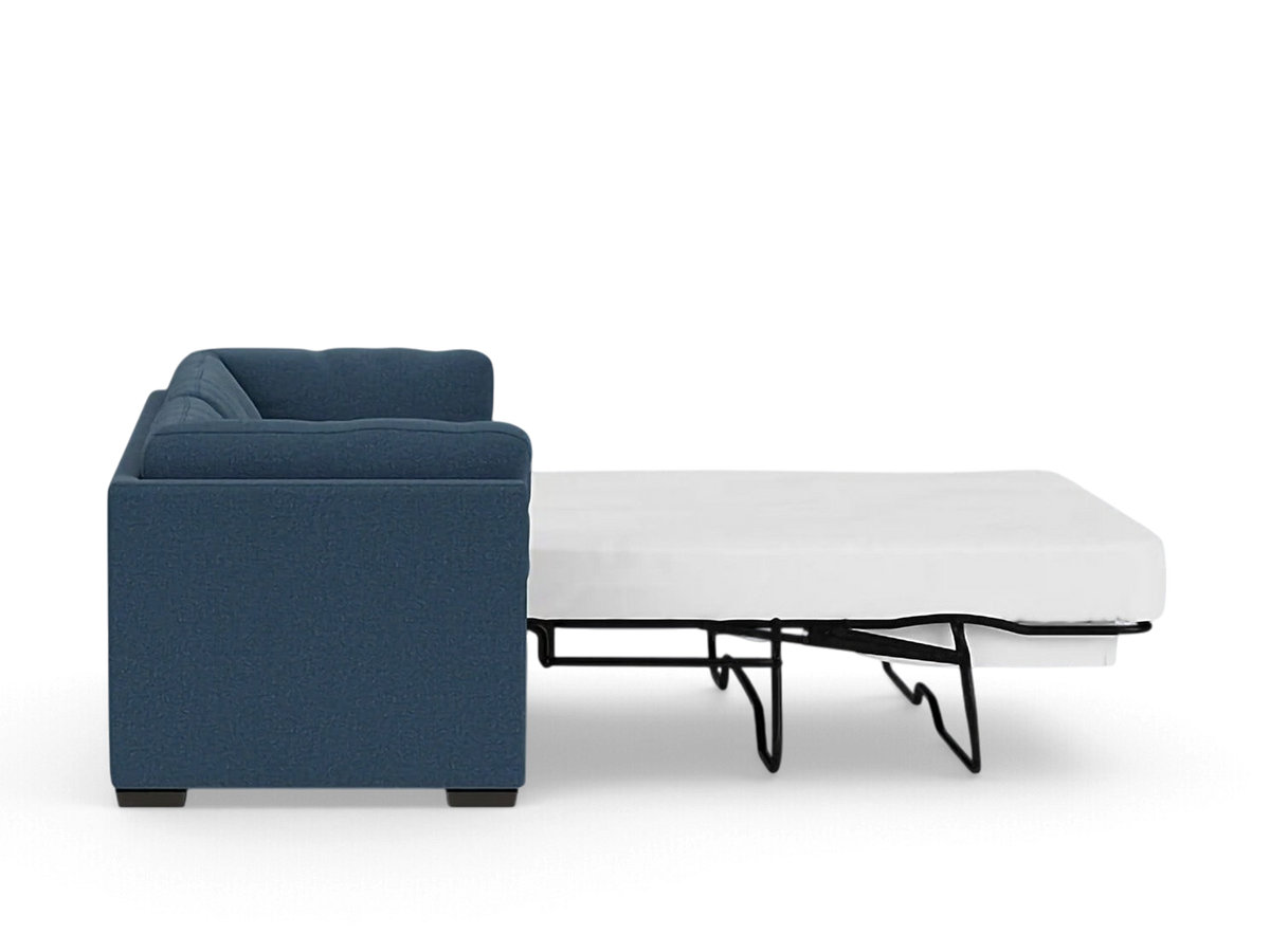 urbane EQ3 Salema sleeper sofa in blue fabric shown from the side with the bed frame extended
