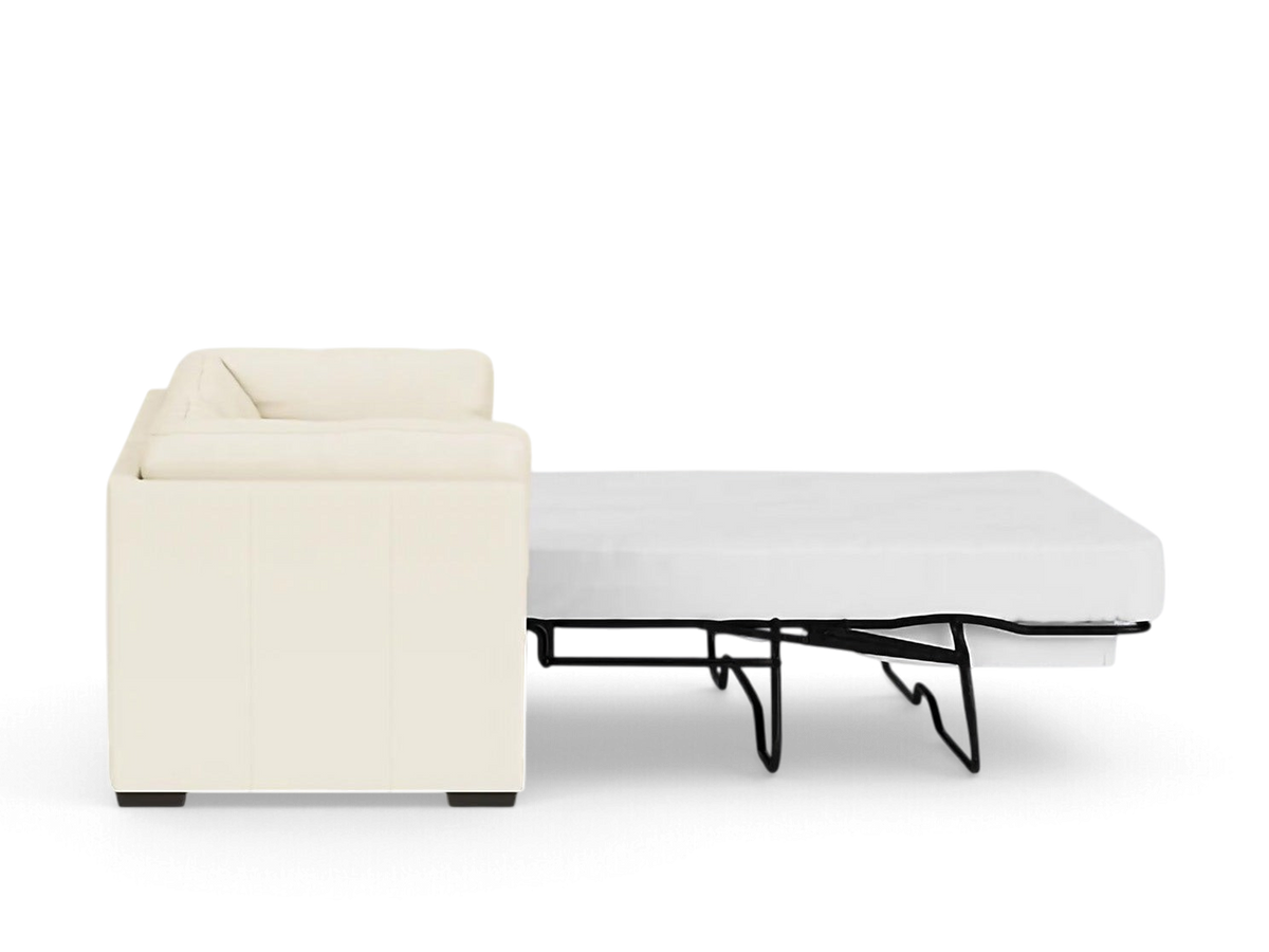 urbane EQ3 Salema sleeper sofa in cream upholstery shown from the side with the bed frame fully extended