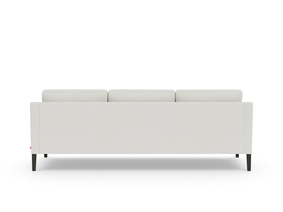 urbane EQ3 Skye sofa in light grey fabric with tapered dark wood legs, viewed from the back