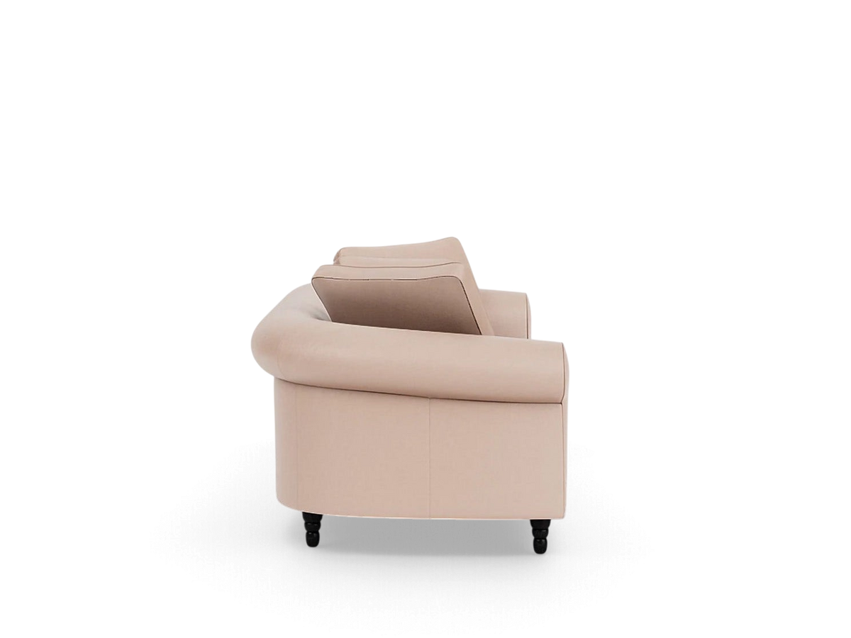 Side view of the urbane EQ3 Slope 94 inch sofa in a soft beige fabric with a modern rolled arm and dark wood legs.