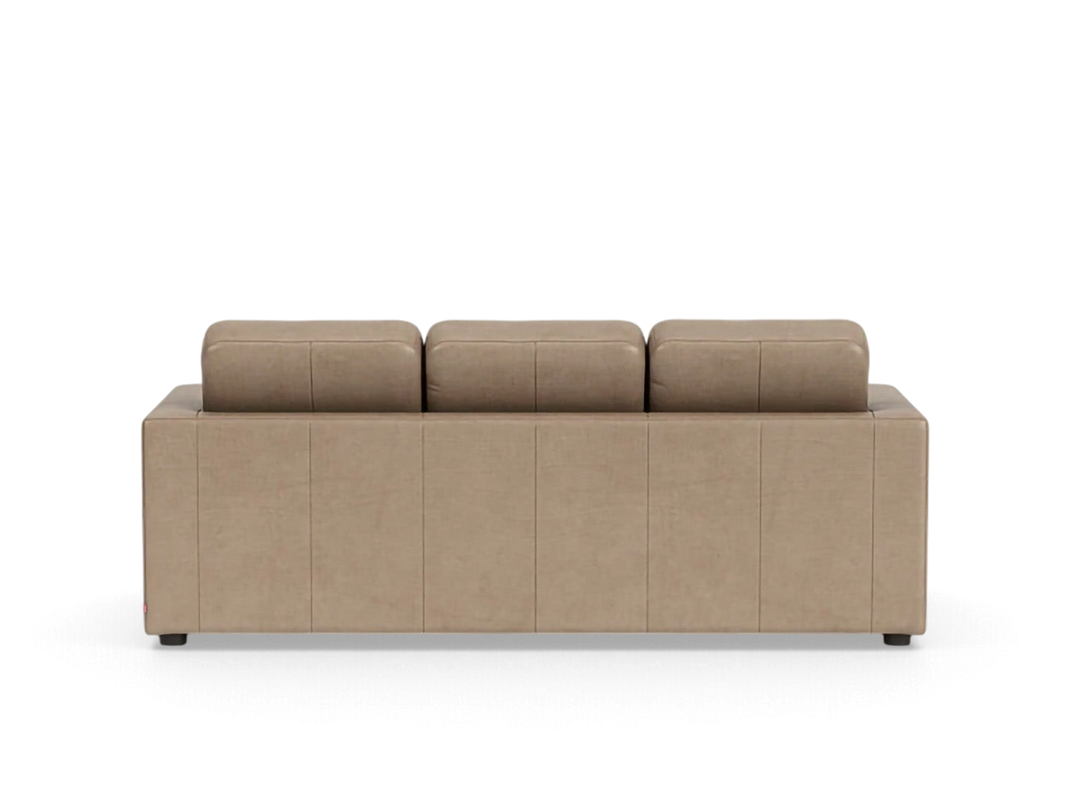 Back view of the urbane EQ3 Solo sleeper sofa in a neutral beige fabric with clean architectural lines.