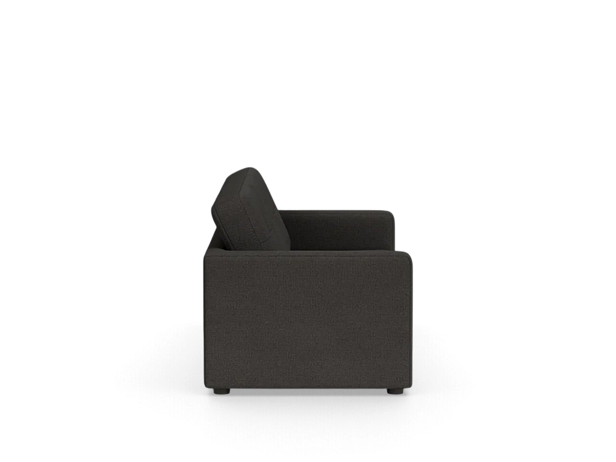 Side view of the urbane EQ3 Solo sleeper sofa in a dark grey fabric with simple architectural lines.