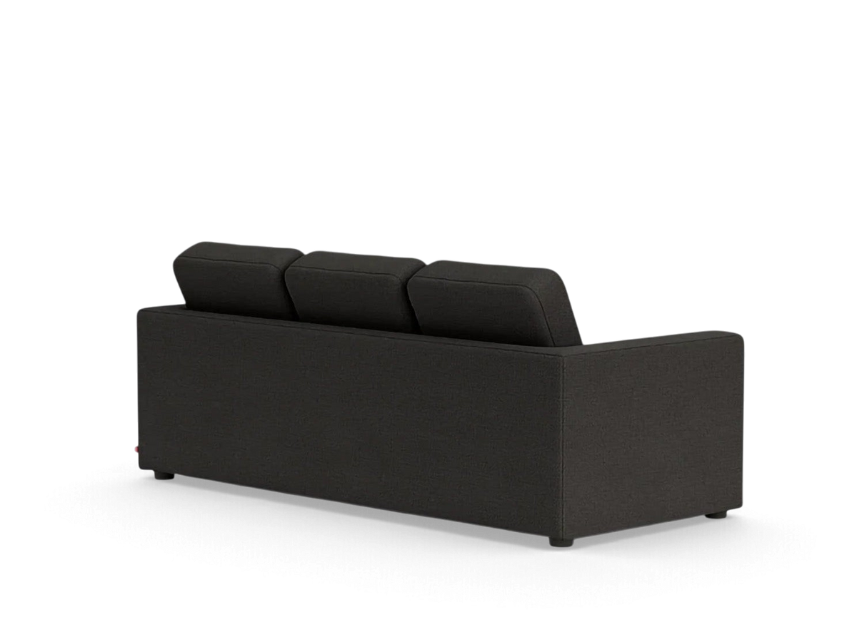 Back view of the urbane EQ3 Solo sleeper sofa in dark grey fabric with simple architectural lines