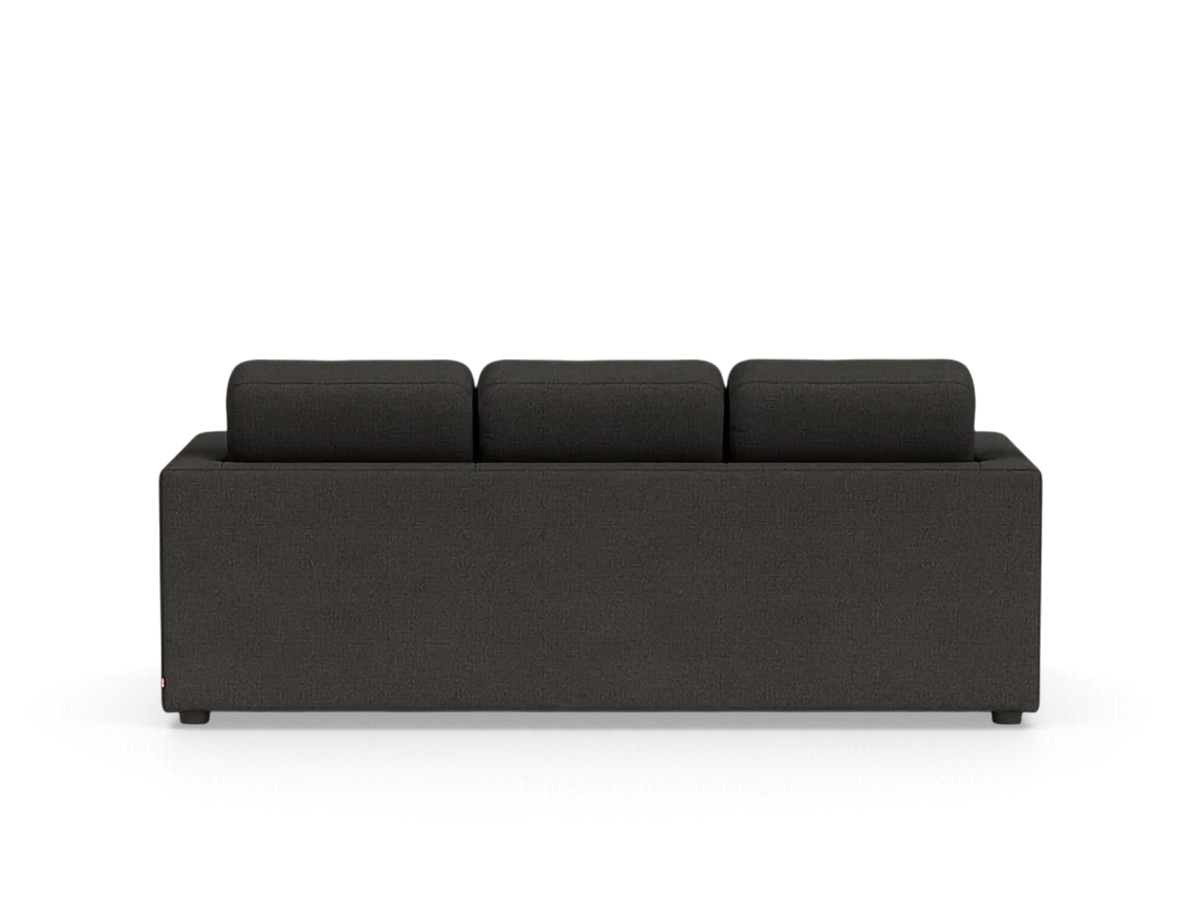 Back view of the urbane EQ3 Solo sleeper sofa in a dark charcoal grey fabric with clean architectural lines.