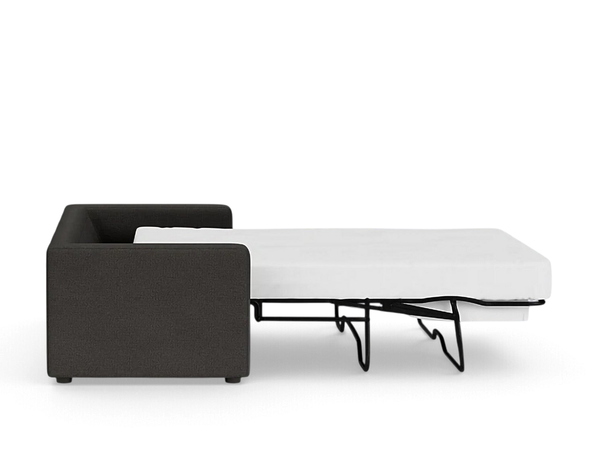 urbane EQ3 Solo sleeper sofa in dark grey fabric with a partially extended white mattress, side view