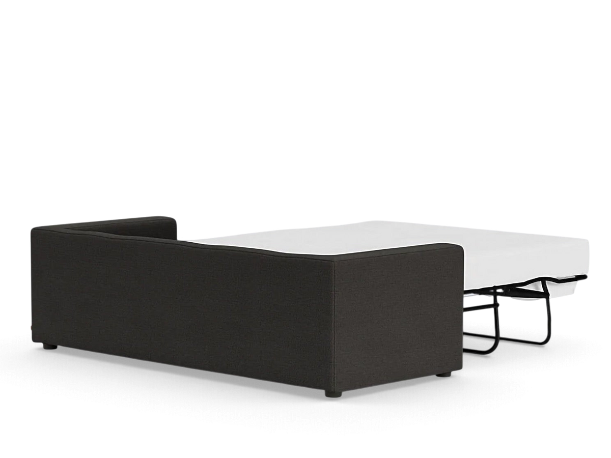 urbane EQ3 Solo sleeper sofa in dark grey fabric with a partially extended white mattress on a black metal frame